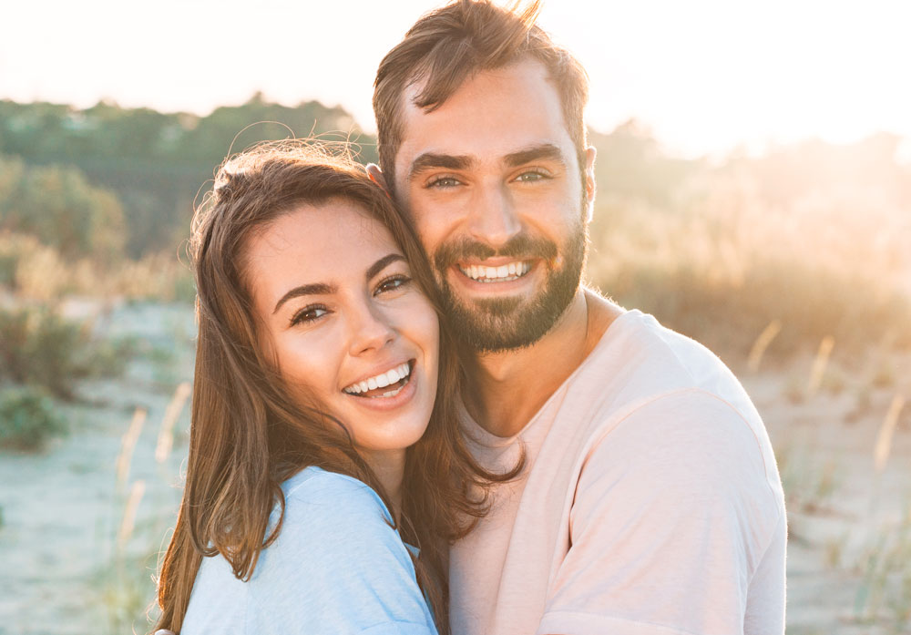 smiling couple with whitened teeth brisbane